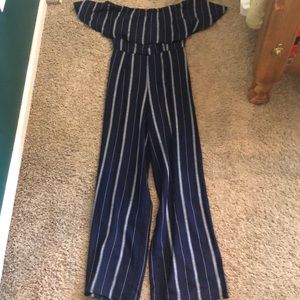A navy blue jumpsuit with stripes